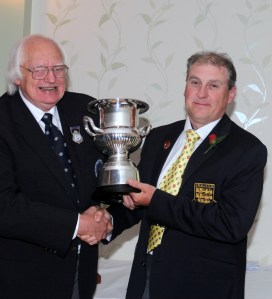 Andy Cliffe receives the Moc Morgan trophy from International President Peter Godfrey